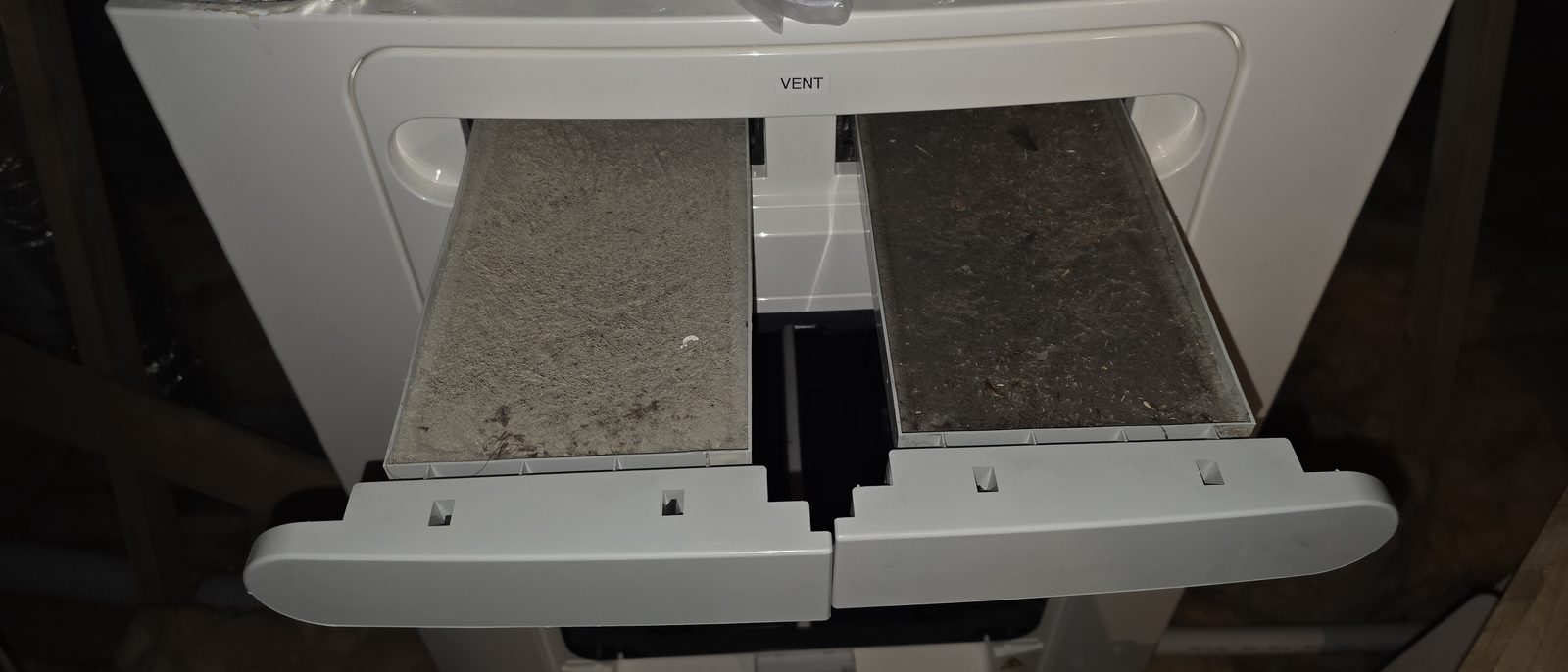 Two clogged filters pulled out of a Vent-Axia MVHR unit