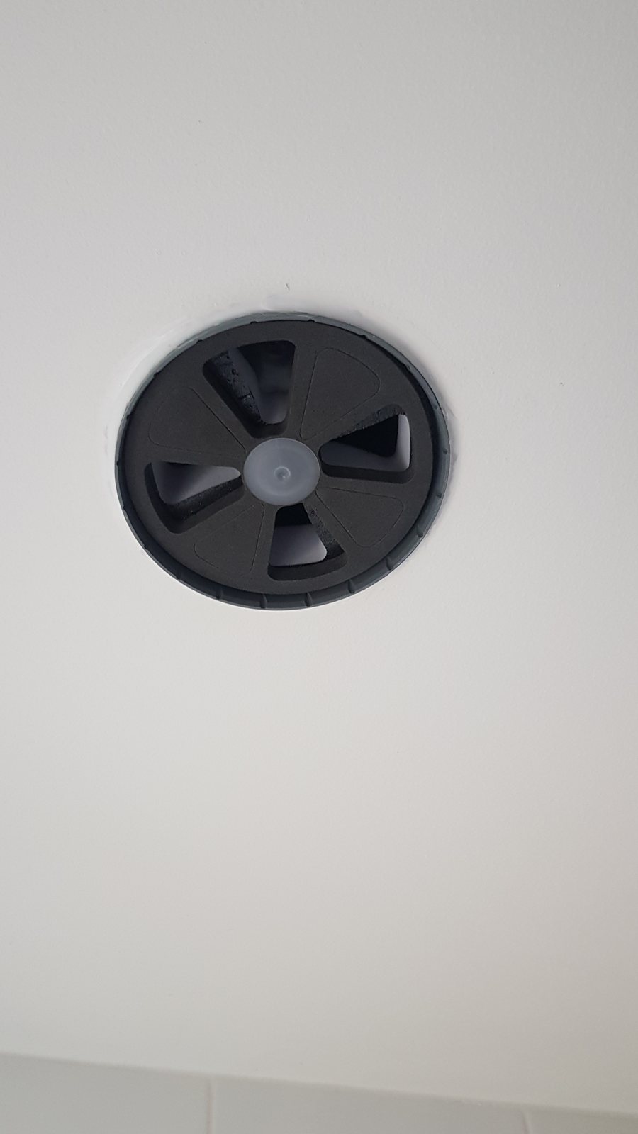 Damper fitted in a ceiling plenum before the air valve goes in