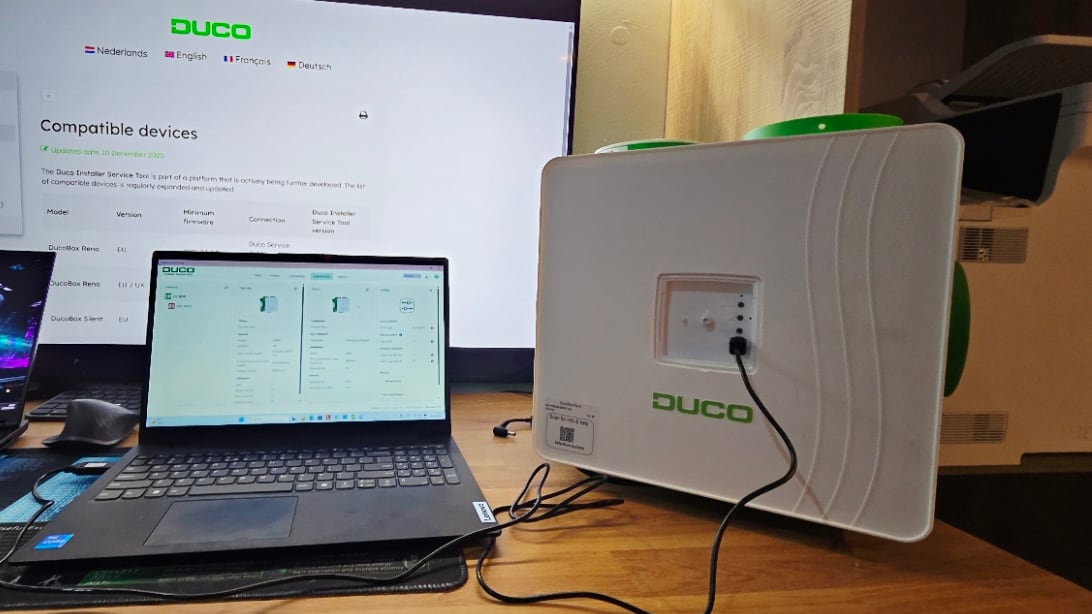 DUCO DucoBox Focus: Demand-Controlled Ventilation Explained - Eco Vent Ireland DucoBox Reno connected to a laptop running the DUCO Installer Service Tool in the Eco Vent Ireland office