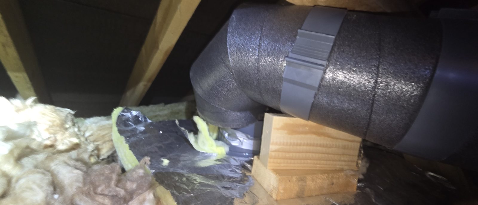 Pre-insulated duct that has come apart at a joint in the attic