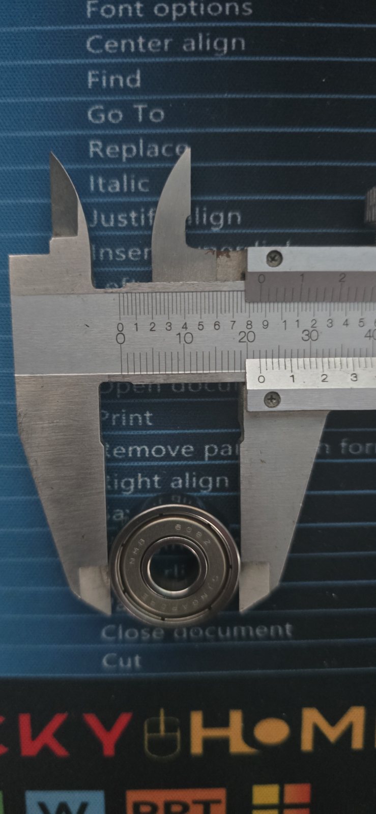 Measuring a fan bearing with a caliper