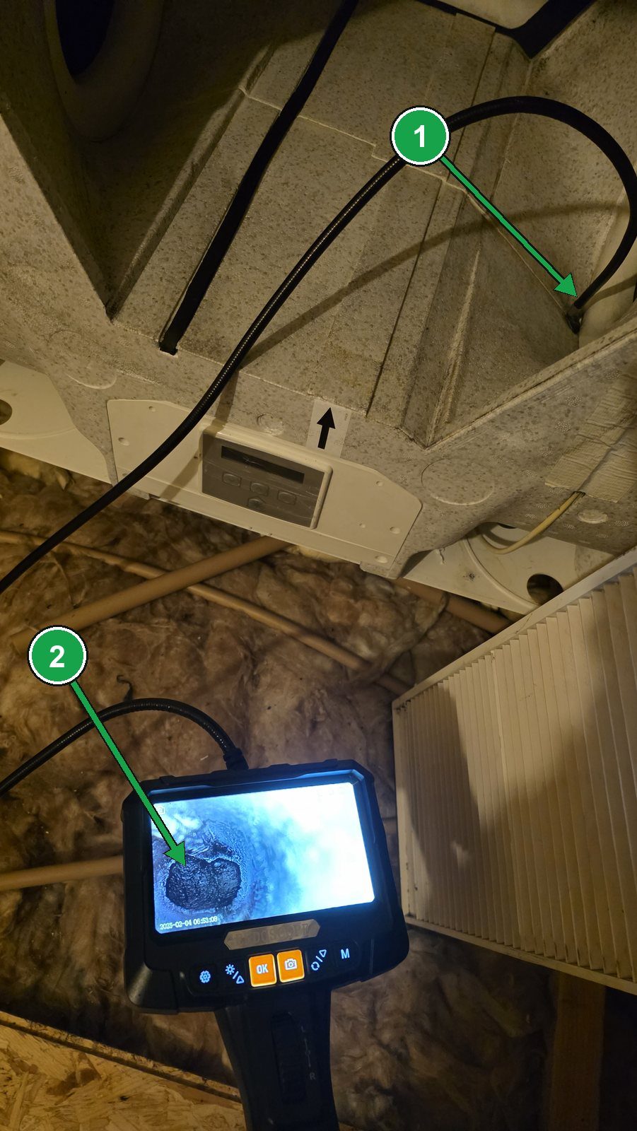 Ventilation Cleaning And Servicing - Eco Vent Ireland Endoscope camera inside an MVHR condensate outlet during a winter service, showing a clear, unblocked pipe