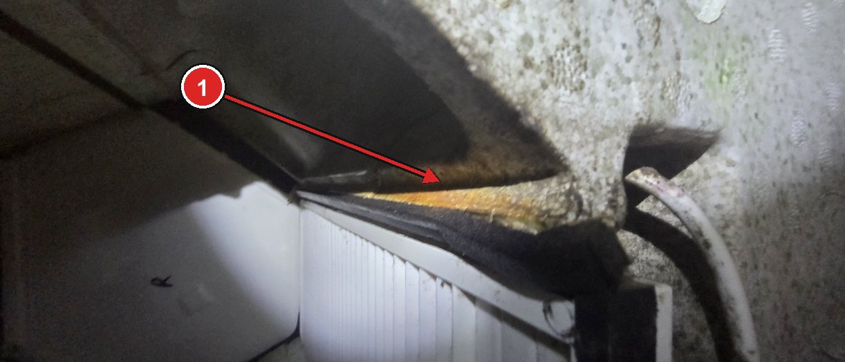 Rust-coloured deposit inside an MVHR unit with the heat exchanger fitted upside down
