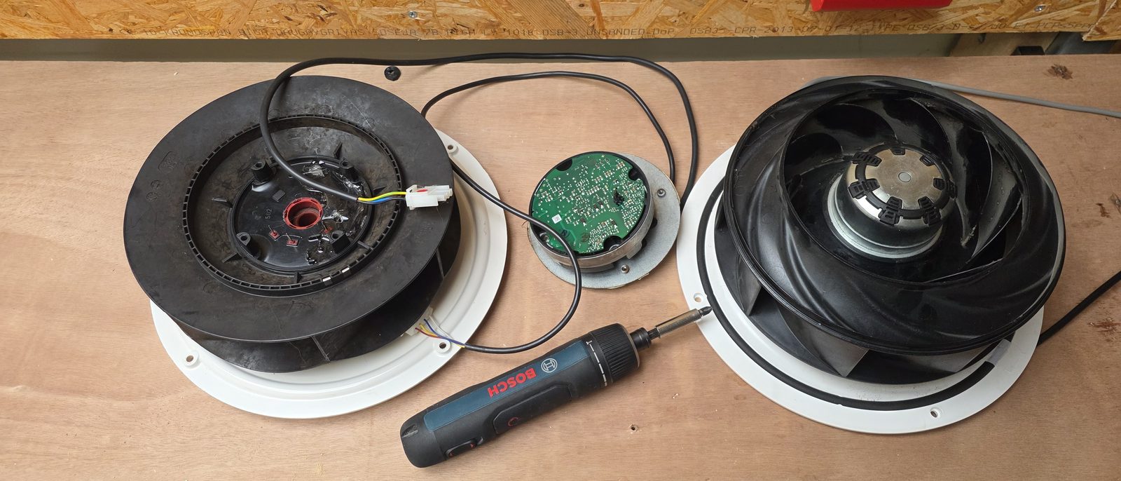 Worn MVHR fan next to the new replacement fan