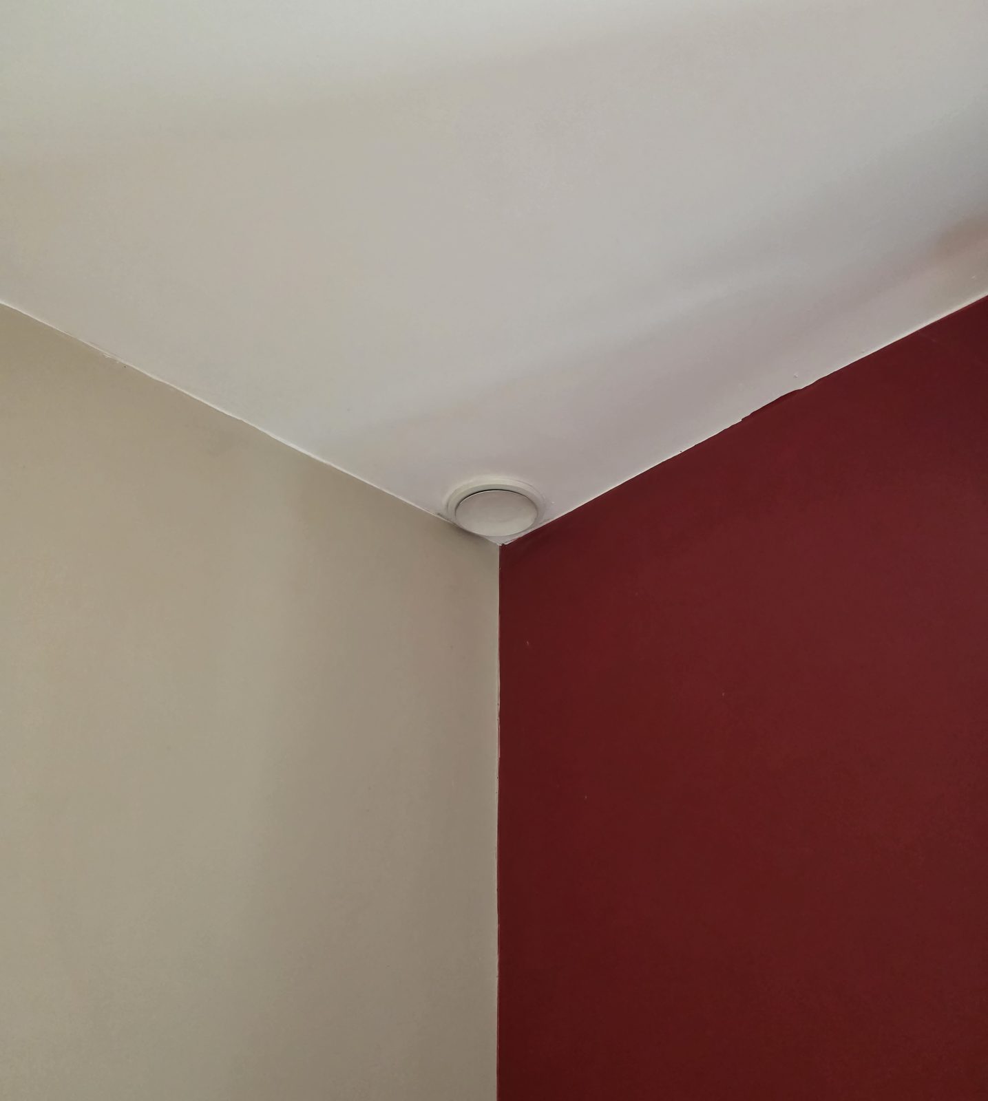 Ceiling valve fitted tight into a room corner
