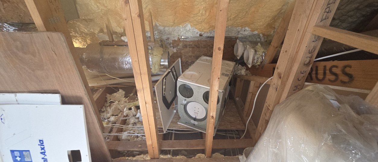 Vent-Axia unit in an attic before the repair