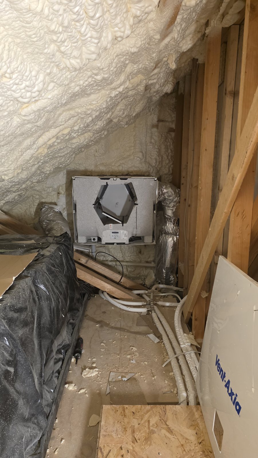 Vent-Axia unit in an attic with no floor, only sloping roof timbers